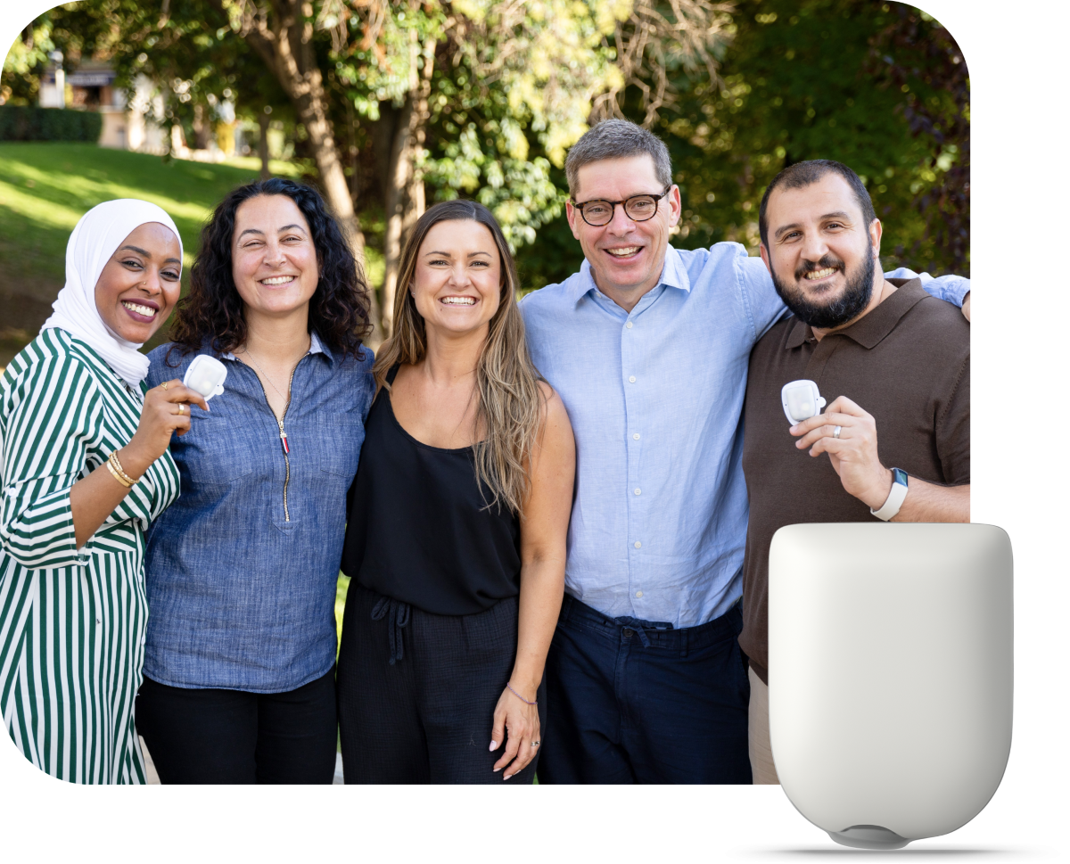 Insulet team standing together while two are holding up Omnipod Pods