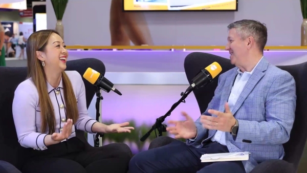 Trang Ly (left) and Jeff Johnson (right) sitting down interviewing for a podcast