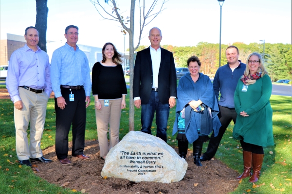 Insulet employees planting a tree on Earth Day