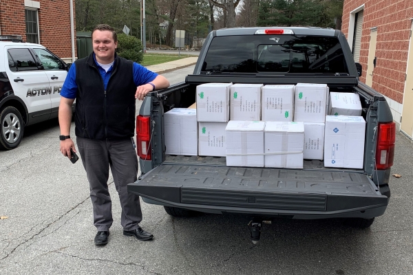 An Insulet employee helps deliver donated goods