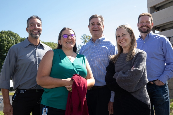 Employee gather outside Acton headquarters