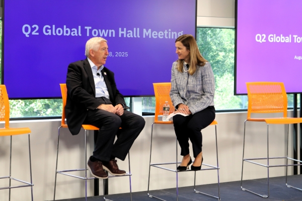 John Brooks and Carolyn speaking at a town hall at Insulet headquarters