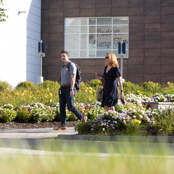 Employees stroll the Acton campus