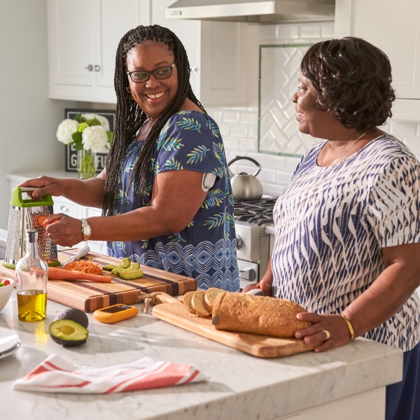 Two women prepping a meal