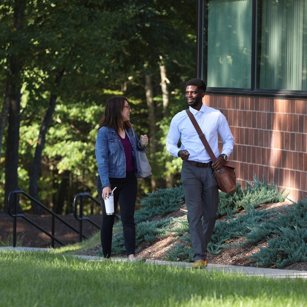 Employees enjoy a walking meeting at Acton headquarters