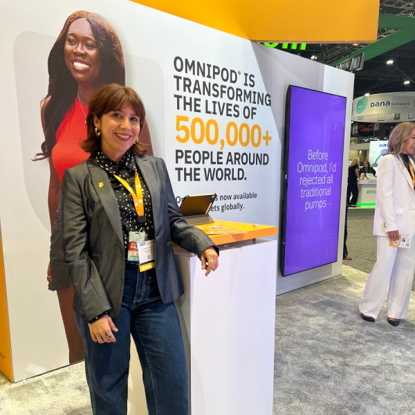 Insulet employee standing at ADA 2025 at Insulet's booth
